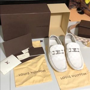 white pair of Louis Vuitton hockenheim loafers